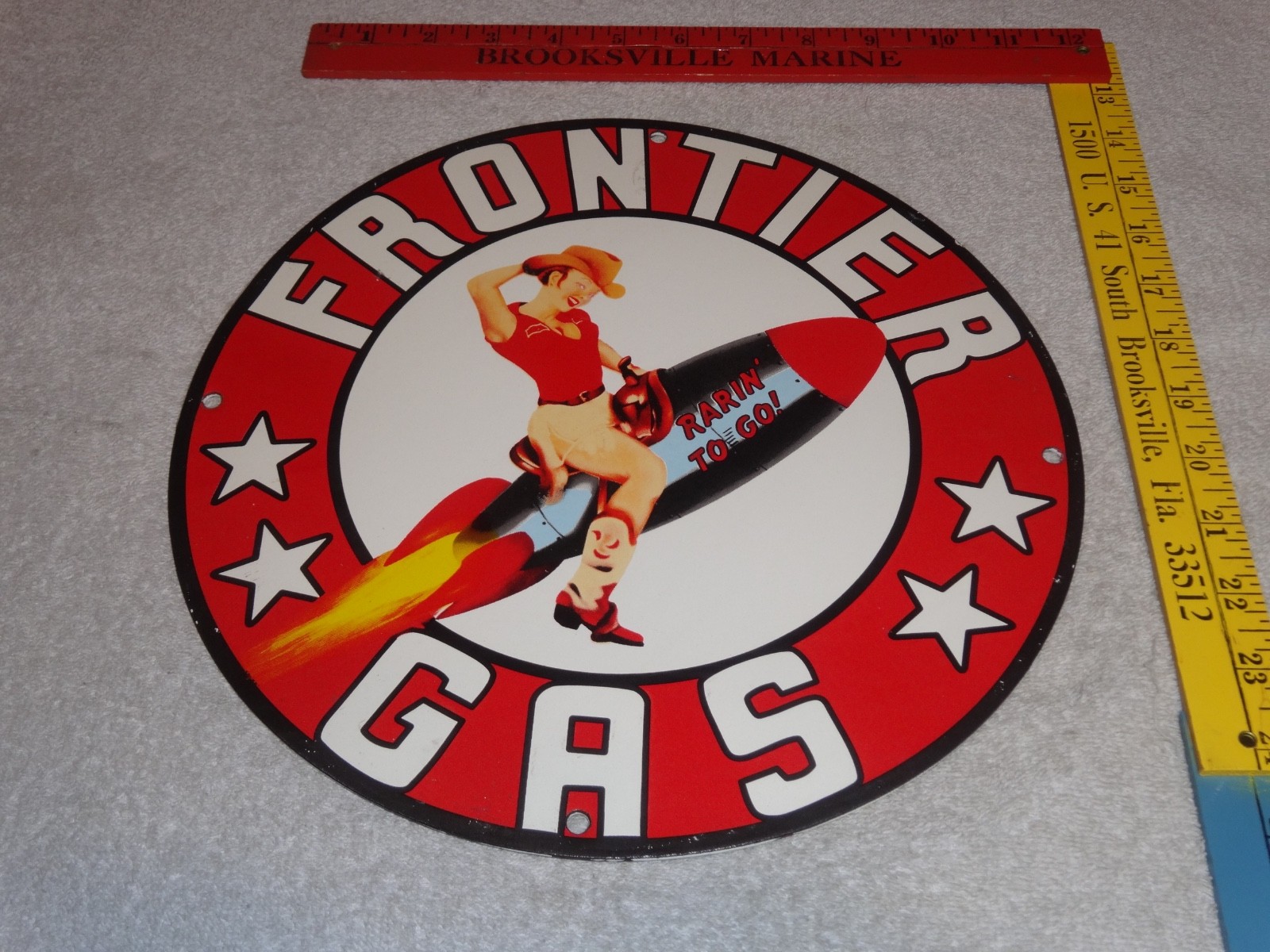 VINTAGE FRONTIER GASOLINE WOMAN ON ROCKET 11 3/4″ PORCELAIN METAL GAS & OIL SIGN
