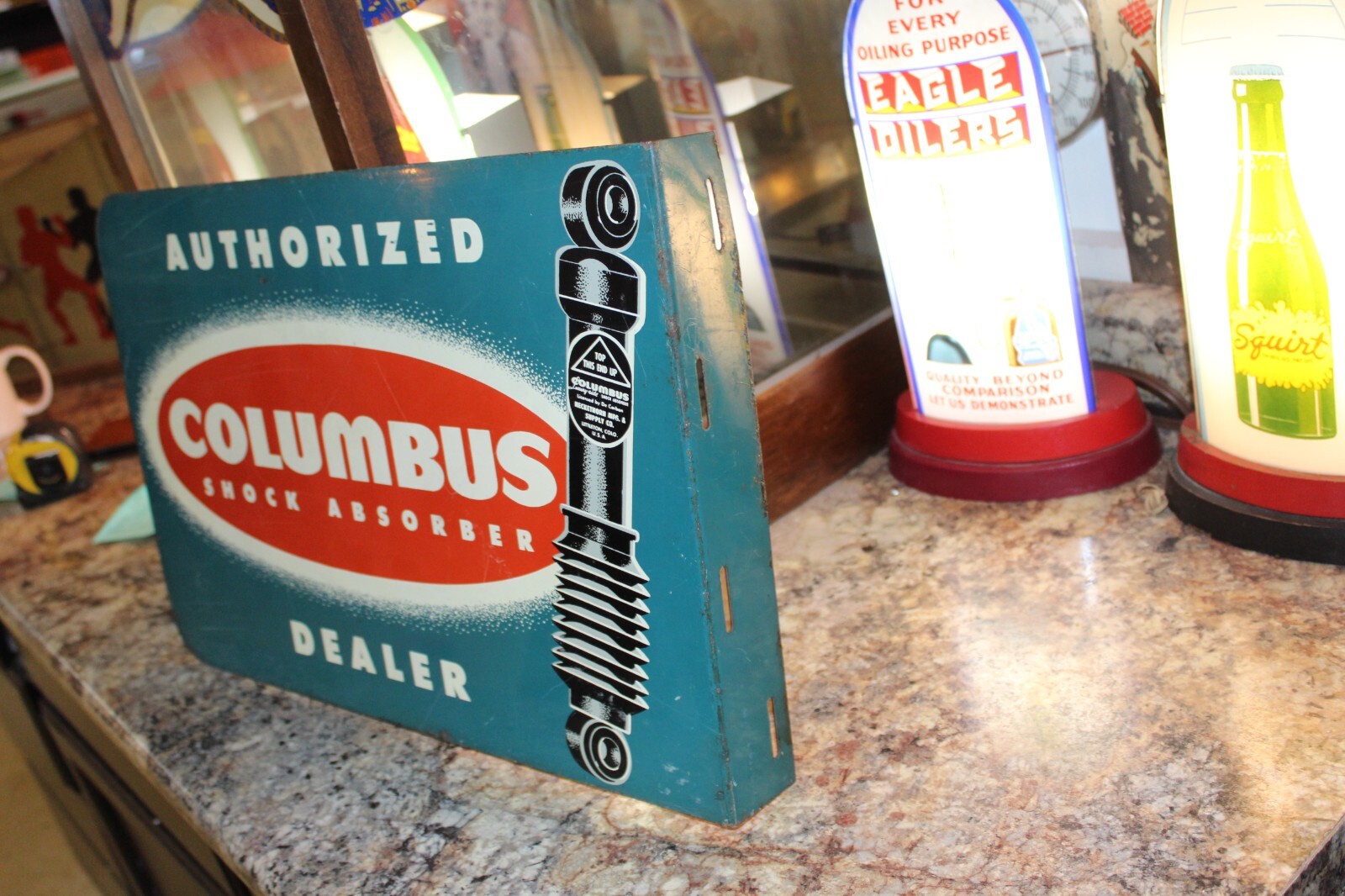 SCARCE 1950s COLUMBUS SHOCK ABSORBER DEALER 2 SIDED PAINTED METAL FLANGE SIGN 66