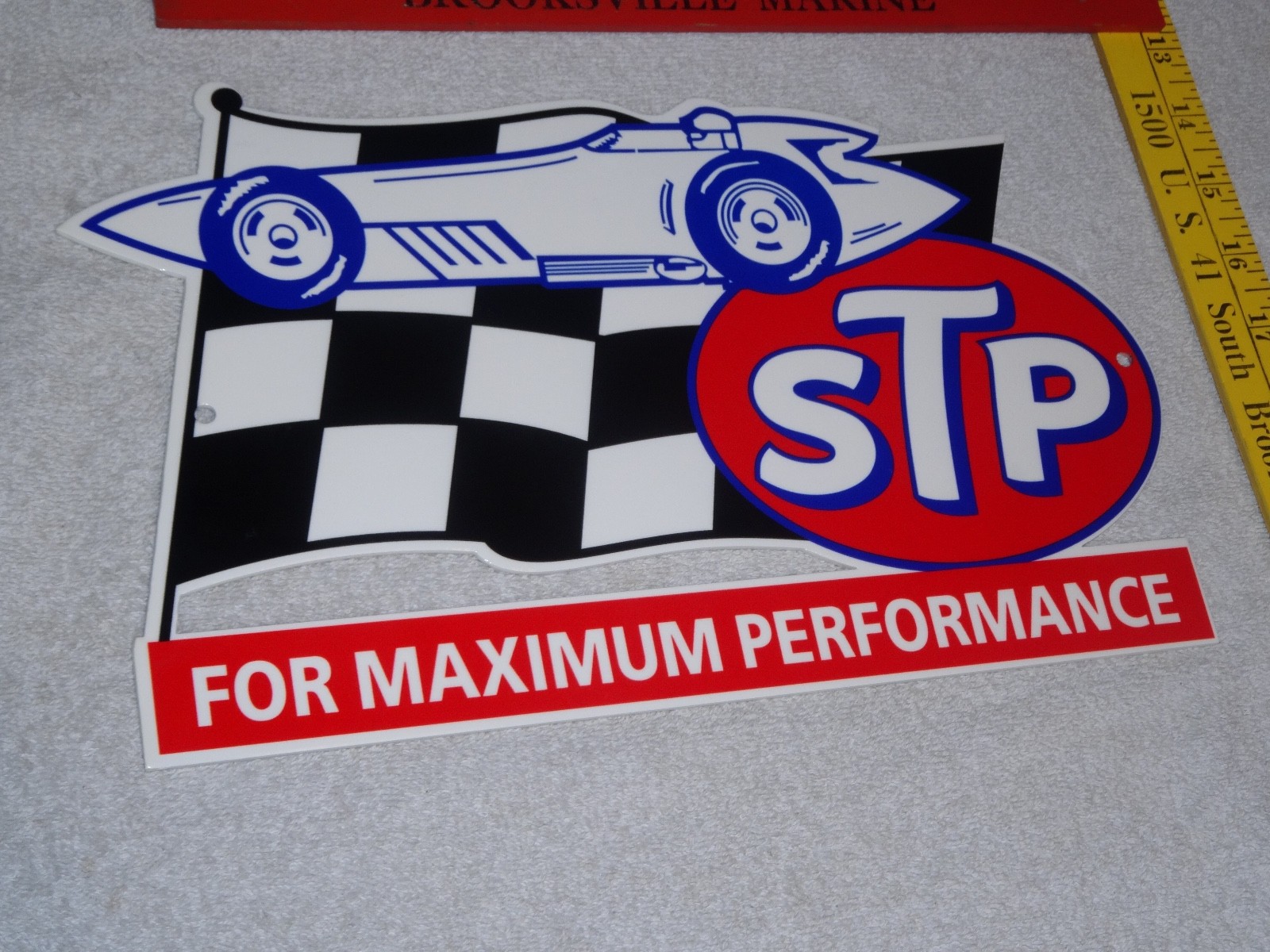 VINTAGE STP OIL ADDITIVE + RACE CAR & FLAG 12″ METAL DIE-CUT GASOLINE SIGN S T P