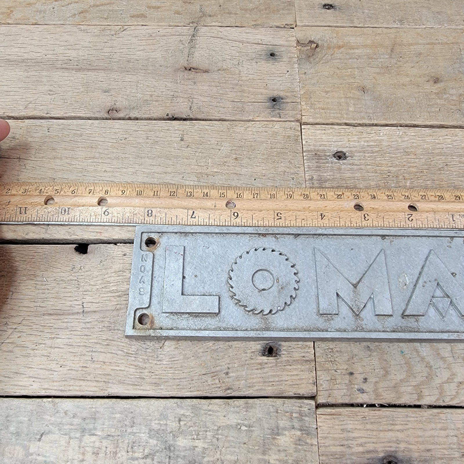 Vintage LOMA Cast Metal Industrial Sign Plate Embossed Gear Logo Plaque