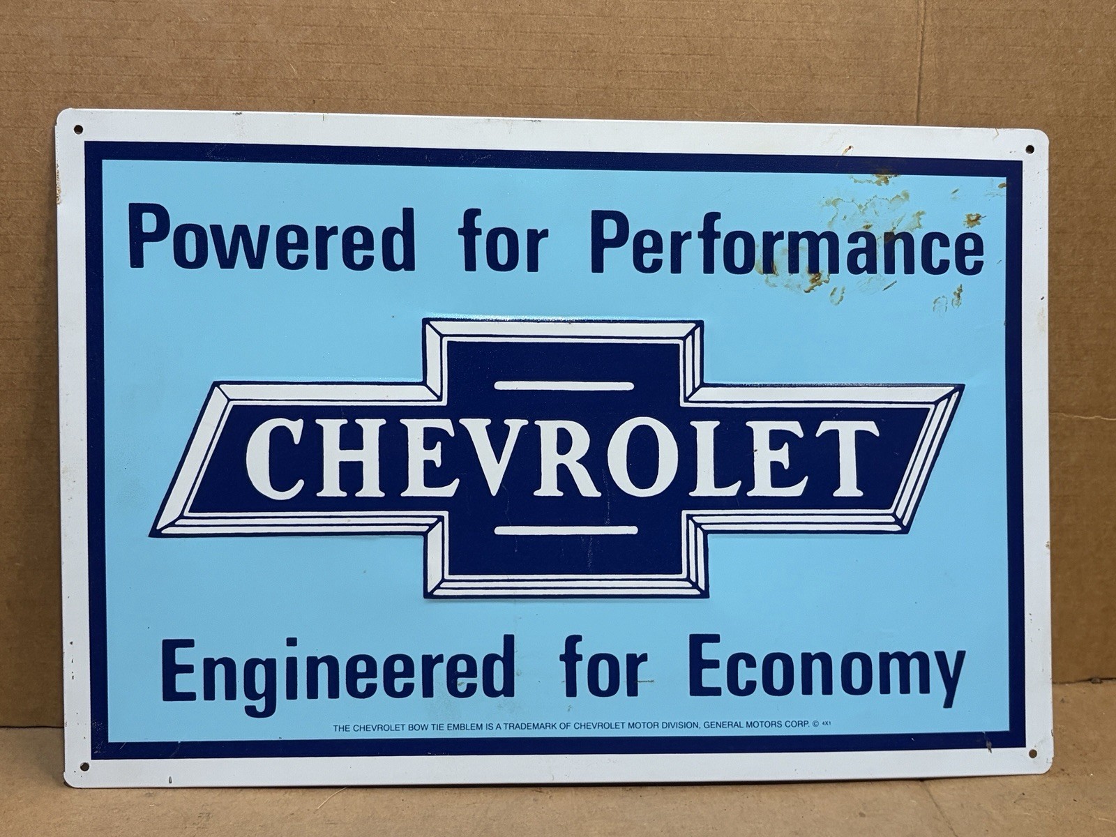 Chevrolet Powered for Performance Embossed Bowtie Metal Sign – 17-3/4″ x 11-3/4″
