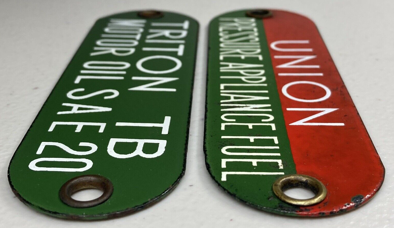 (2) Union Pressure Appliance Fuel & Triton 20 Porcelain Tag Gas Oil Sign Badge