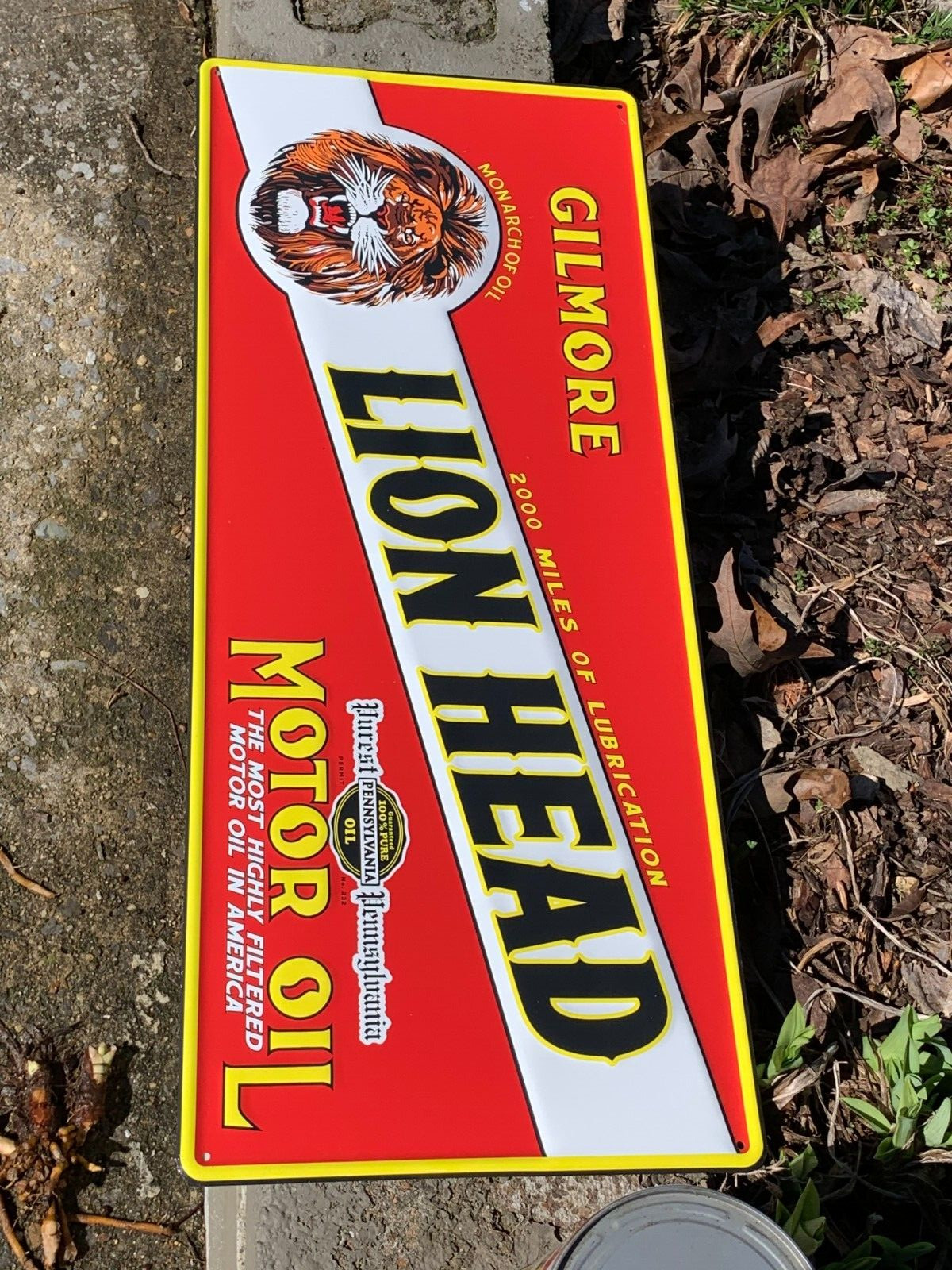 “LION HEAD MOTOR OIL” EMBOSSED METAL SIGN, (23.5″x 9.5″) EXCELLENT CONDITION