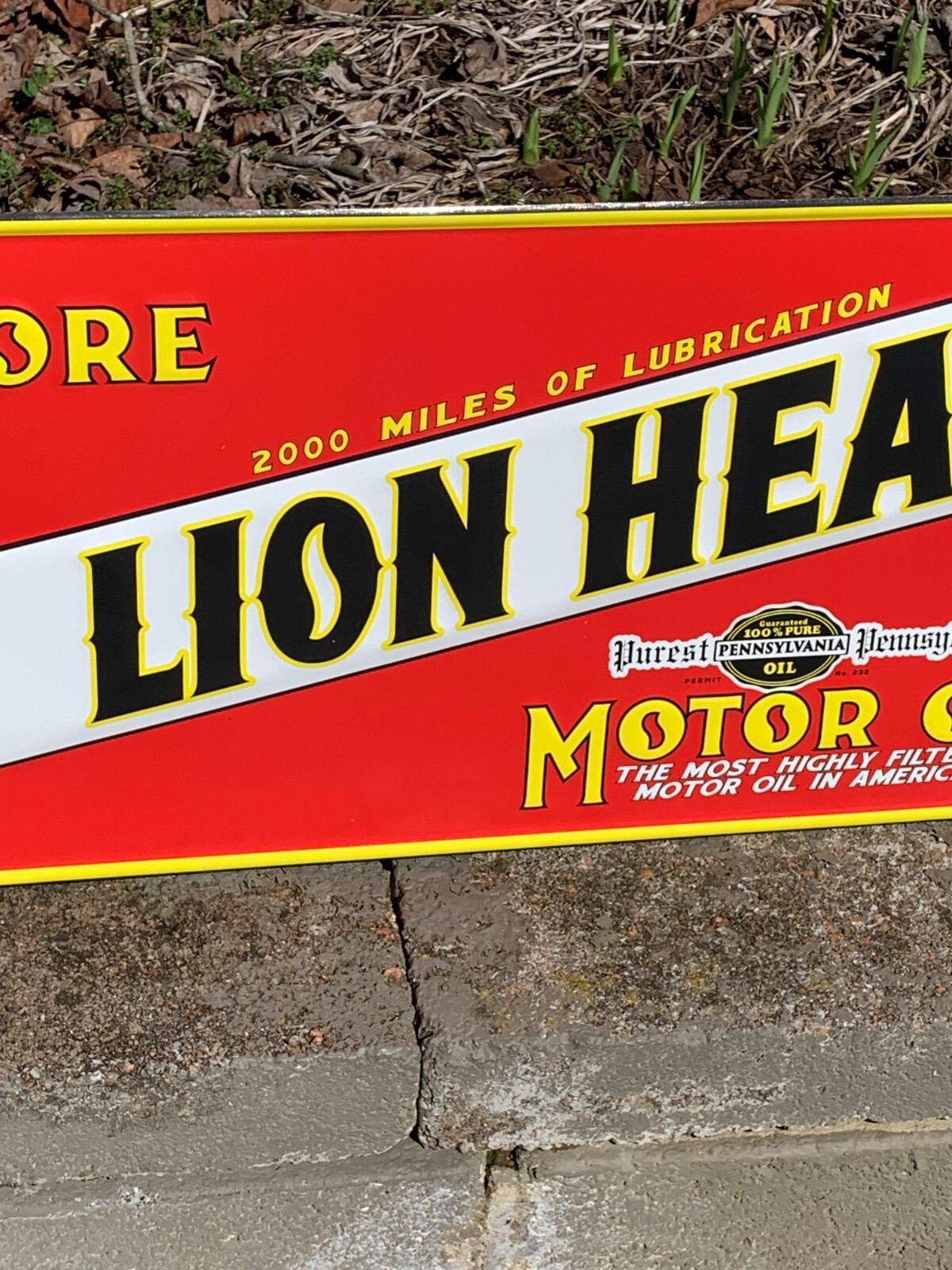 “LION HEAD MOTOR OIL” EMBOSSED METAL SIGN, (23.5″x 9.5″) EXCELLENT CONDITION