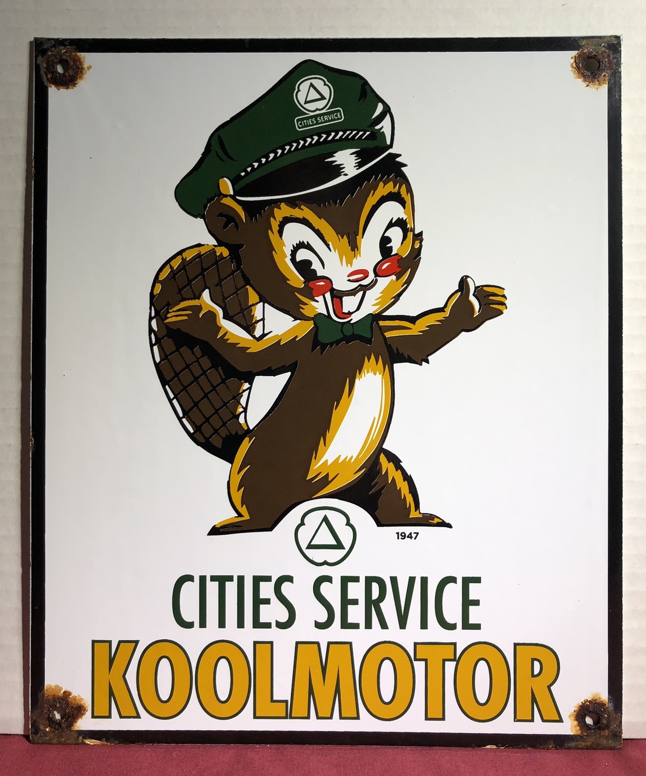 VINTAGE 1947 DATED CITIES SERVICE KOOLMOTOR 12” PORCELAIN GAS SQUIRREL SIGN