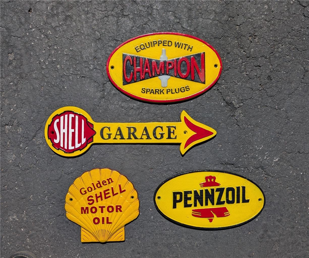LOT OF 4 CAST IRON GAS & OIL SIGNS SHELL PENNZOIL CHAMPION GARAGE ARROW SIGN