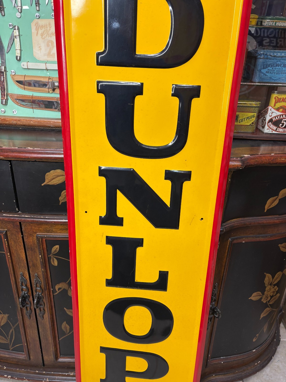 ORIGINAL 1965 “DUNLOP TIRES” LARGE EMBOSSED METAL DEALER SIGN, (60″x 14″) NICE