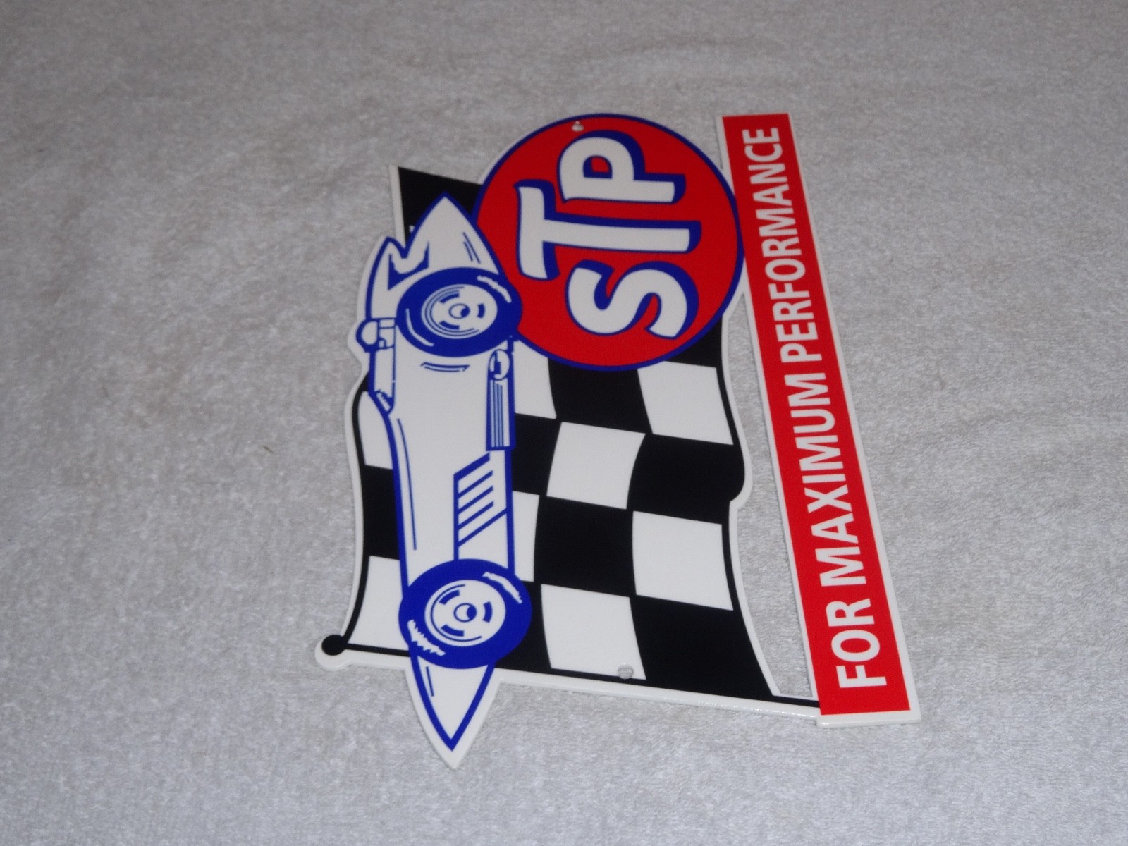 VINTAGE STP OIL ADDITIVE + RACE CAR & FLAG 12″ METAL DIE-CUT GASOLINE SIGN S T P