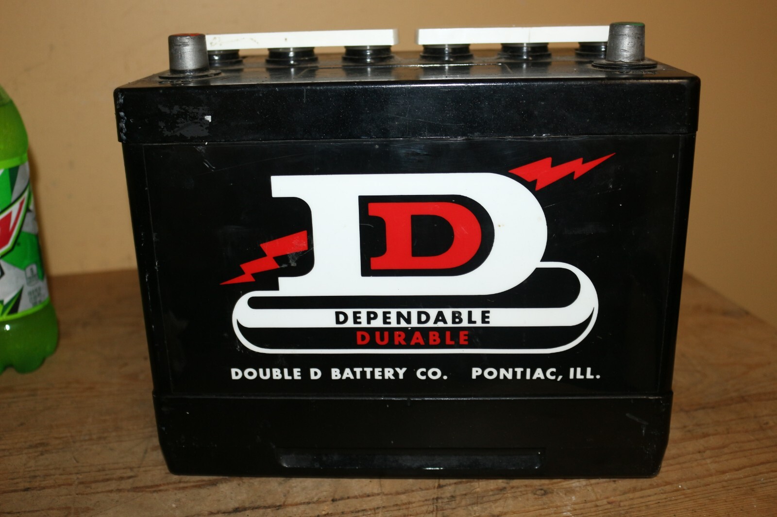 Large 1970s Vintage Double D Battery Co. Pontiac Illinois Coin Bank Gas Oil Sign