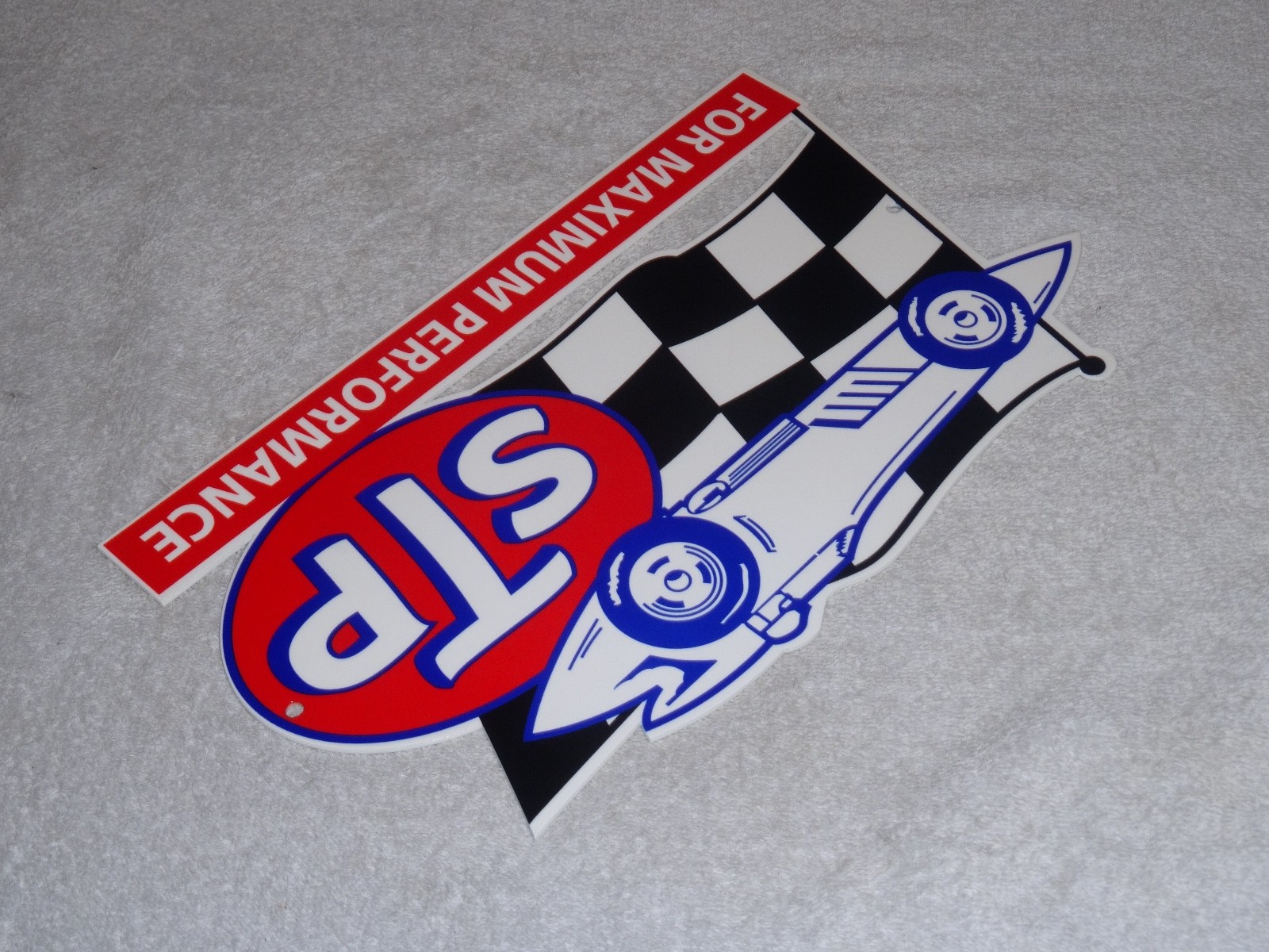 VINTAGE STP OIL ADDITIVE + RACE CAR & FLAG 12″ METAL DIE-CUT GASOLINE SIGN S T P