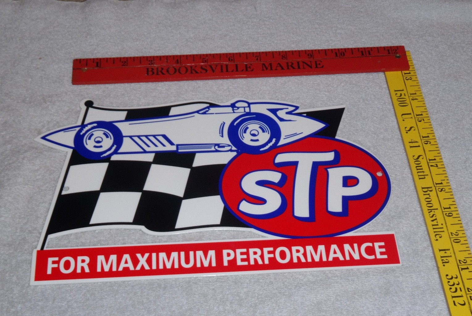 VINTAGE STP OIL ADDITIVE + RACE CAR & FLAG 12″ METAL DIE-CUT GASOLINE SIGN S T P