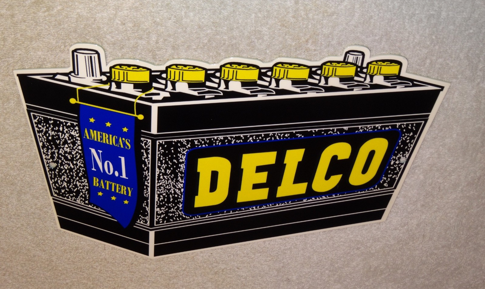 VINTAGE DELCO DIE-CUT BATTERY+ GENERAL MOTORS 12″ ENAMEL METAL GASOLINE OIL SIGN