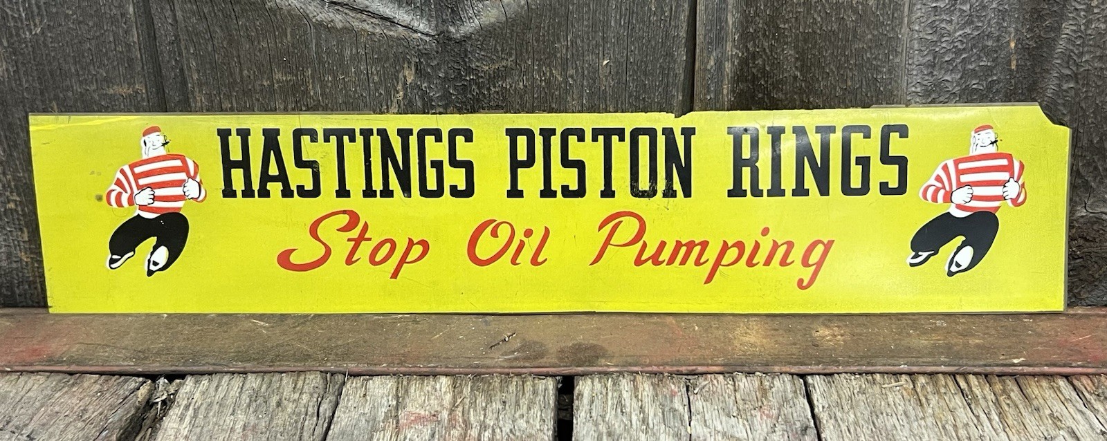 Vintage Hastings Piston Rings Dealer Advertising Sign Tough Guy Graphics 19×4