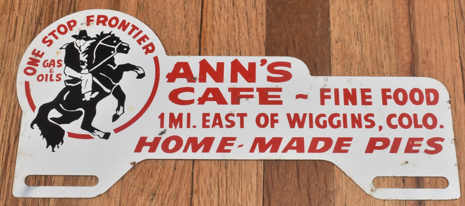 Vintage Frontier Gas & Oil Anns Cafe Wiggins CO Advertising License Plate Topper