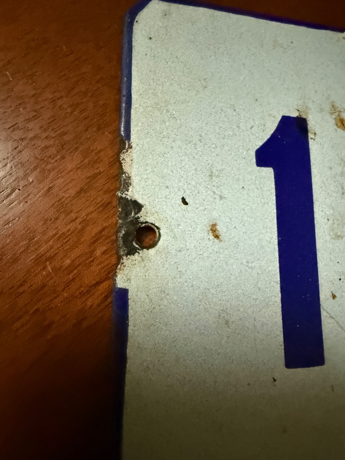 Vintage porcelain enamel metal sign “16”