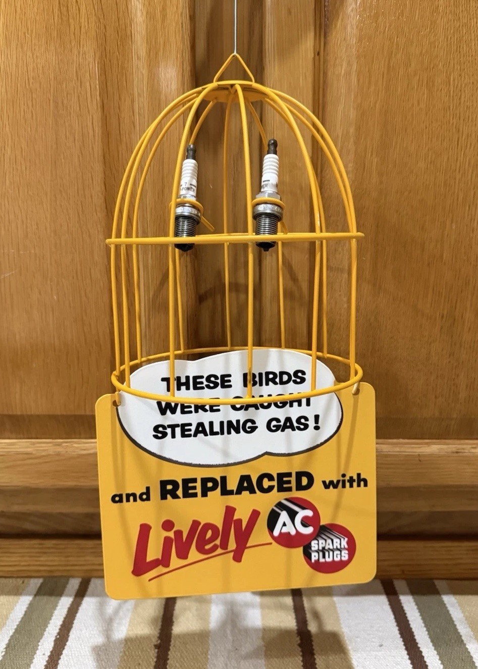 AC Spark Plug Bird Cage Caught Stealing Gas Station Oil Sign Vintage Style Decor