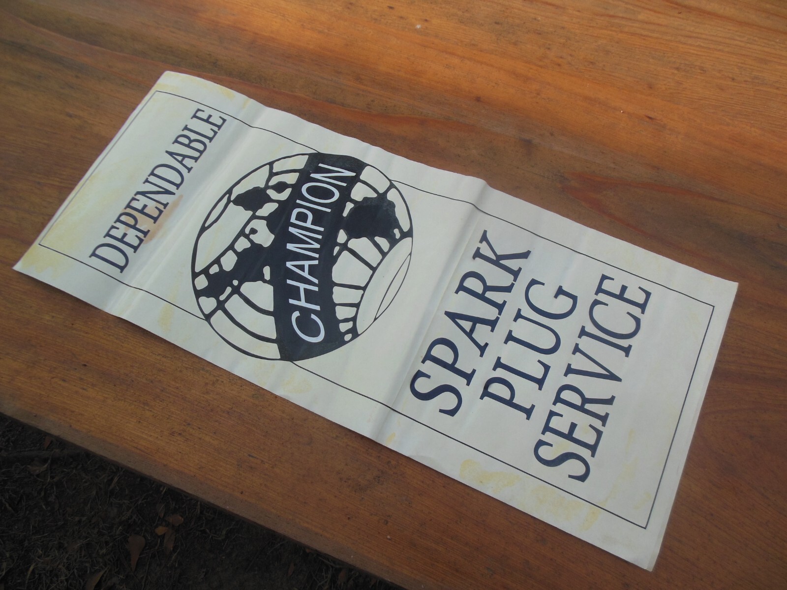Vintage Champion Spark Plug Service Paper Vinyl Sign 26″ x 11″