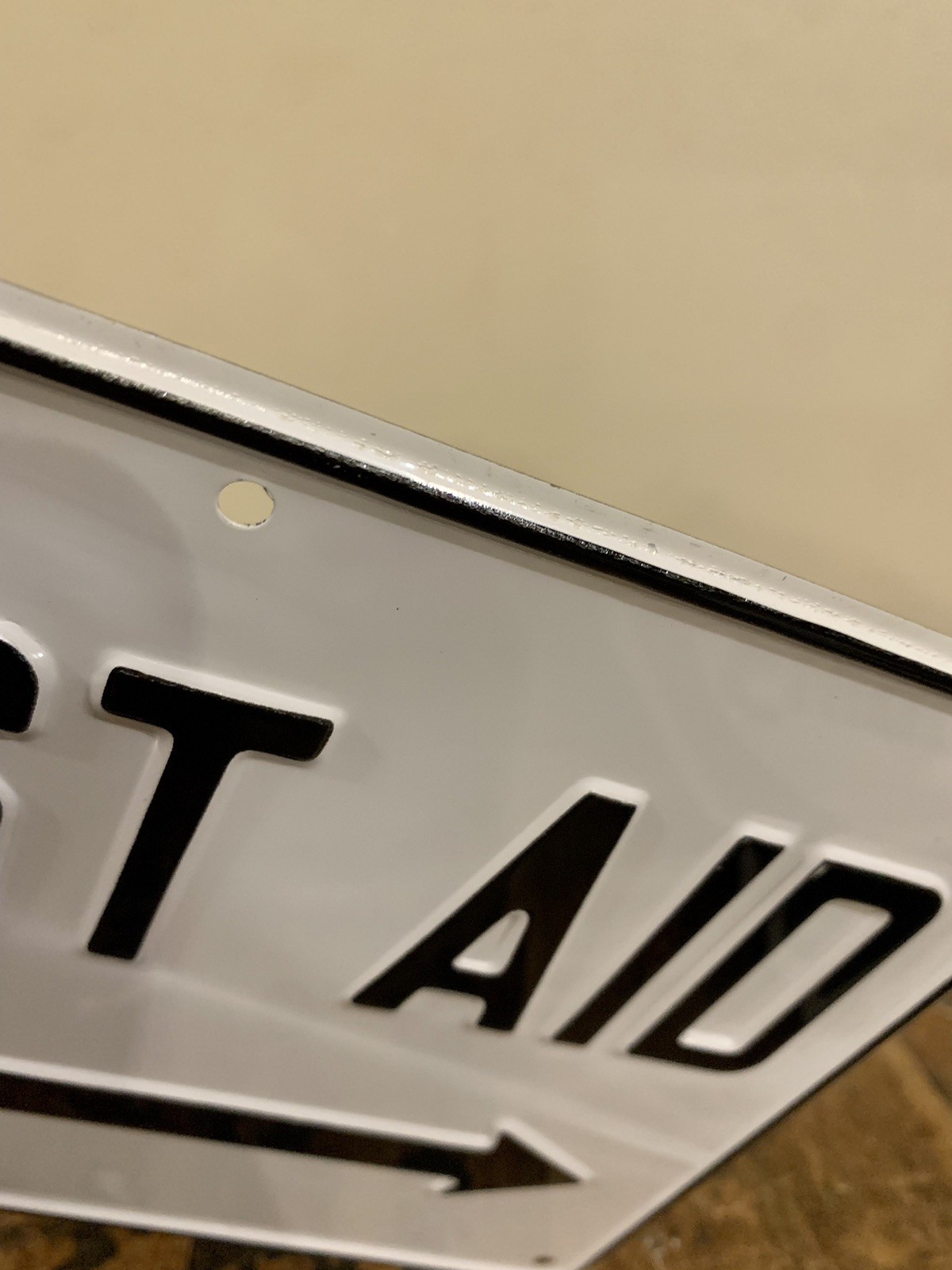Vintage NOS First Aid w/ Arrow Embossed Metal Black and White Sign