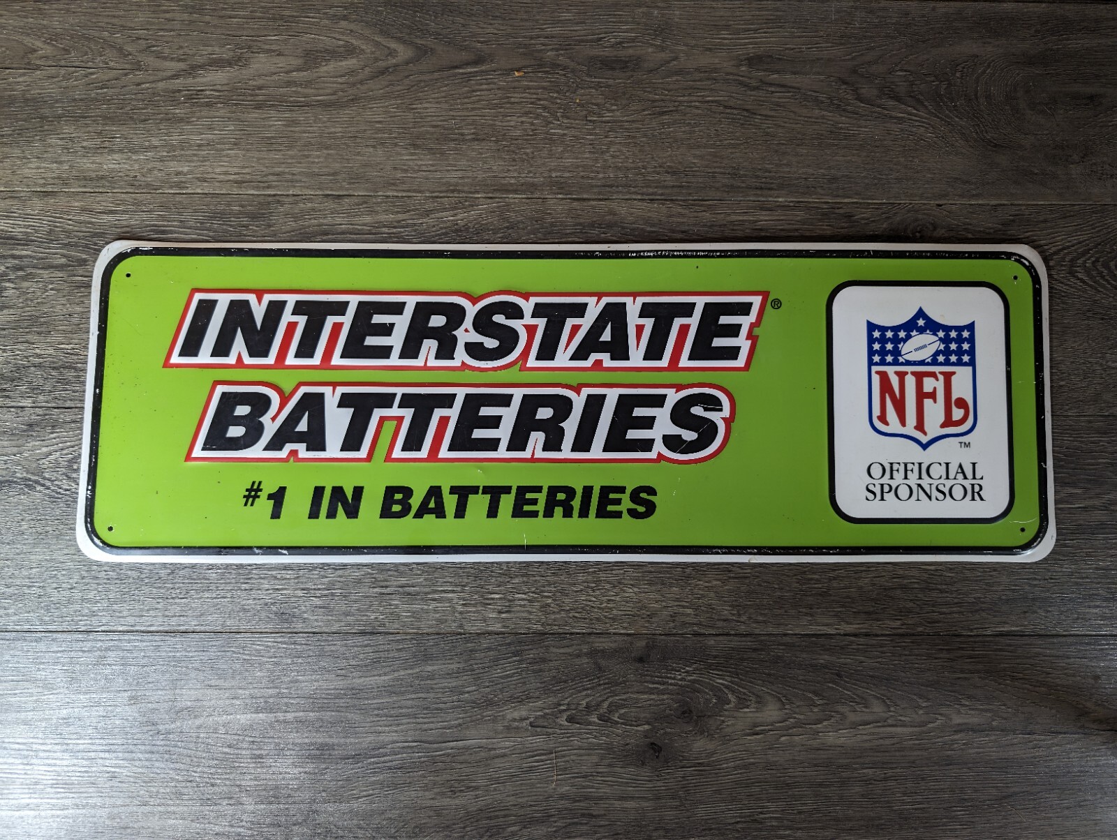 VINTAGE INTERSTATE BATTERIES BATTERY NFL EMBOSSED METAL SIGN AUTO GAS OIL