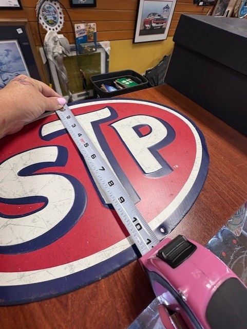STP Tin Embossed Oval Sign 16″ x 11 1/8″ made by Open Road Brands Garage Sign