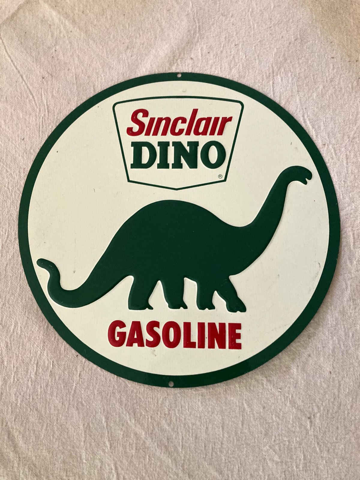 sinclair dino gasoline ‘retro’ metal sign – 10.75″ round embossed VGC light wear