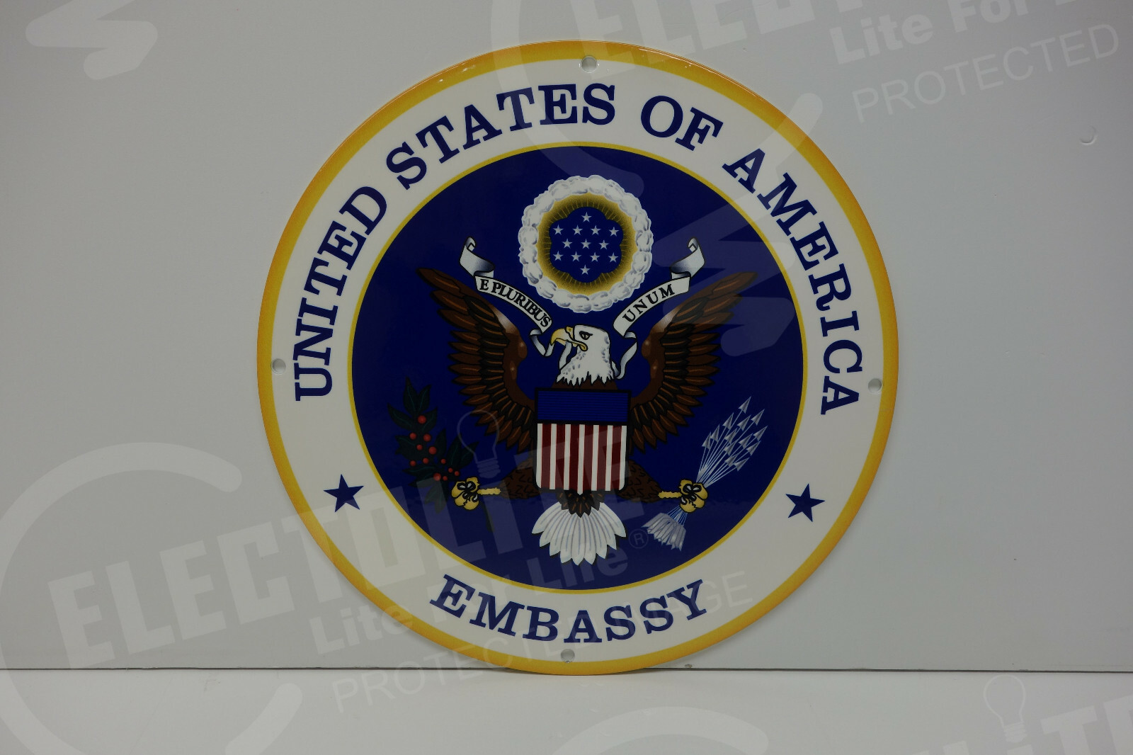 HEAVY STEEL ENAMEL UNITED STATES EMBASSY SIGN. 9 INCHES IN DIAMETER