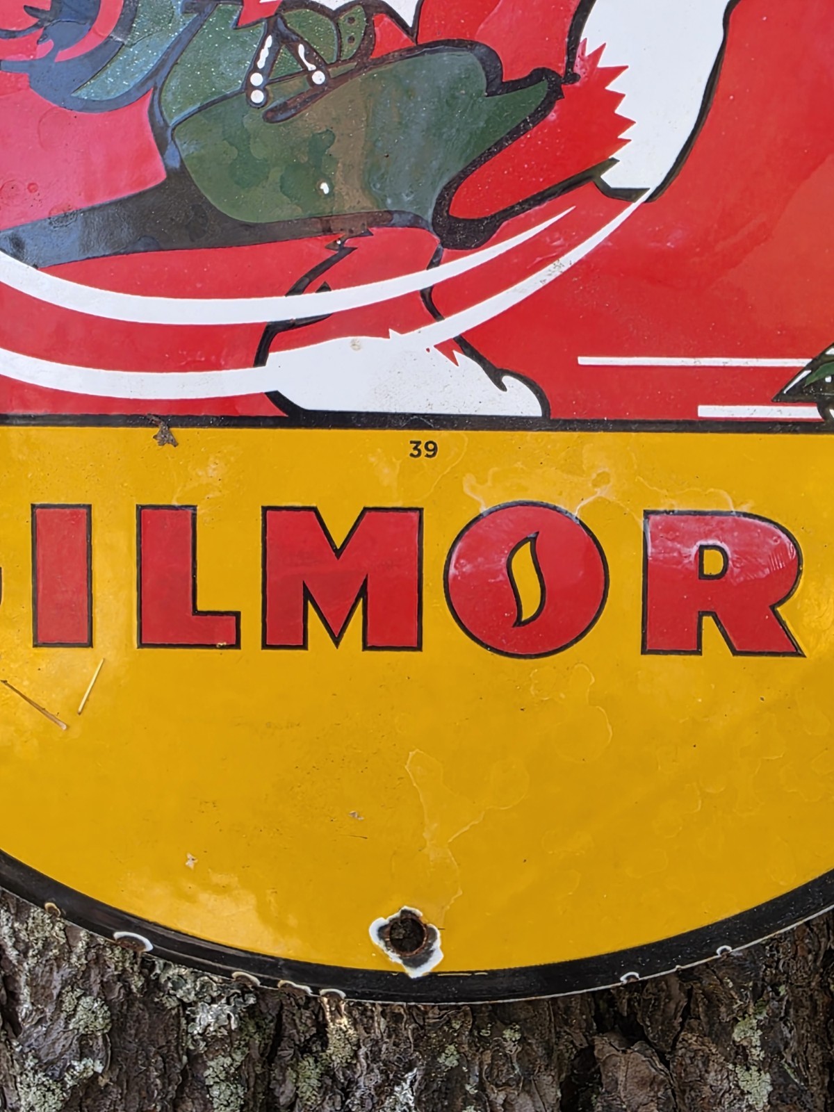 VINTAGE GILMORE PORCELAIN SIGN – YOU’LL GET A KICK OUTA RED LION GAS 12″