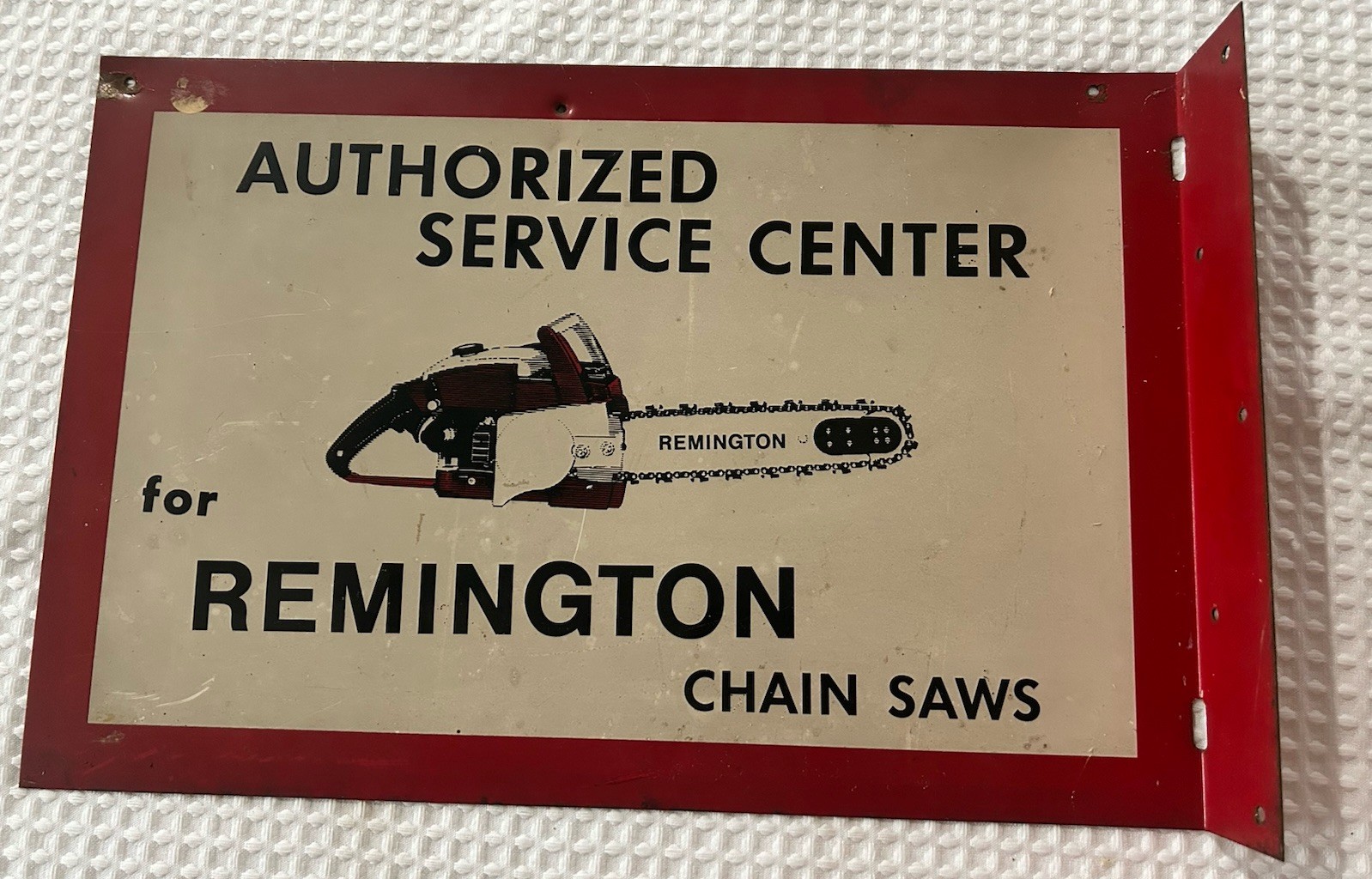 VINTAGE METAL REMINGTON CHAINSAW ADVERTISING SIGN