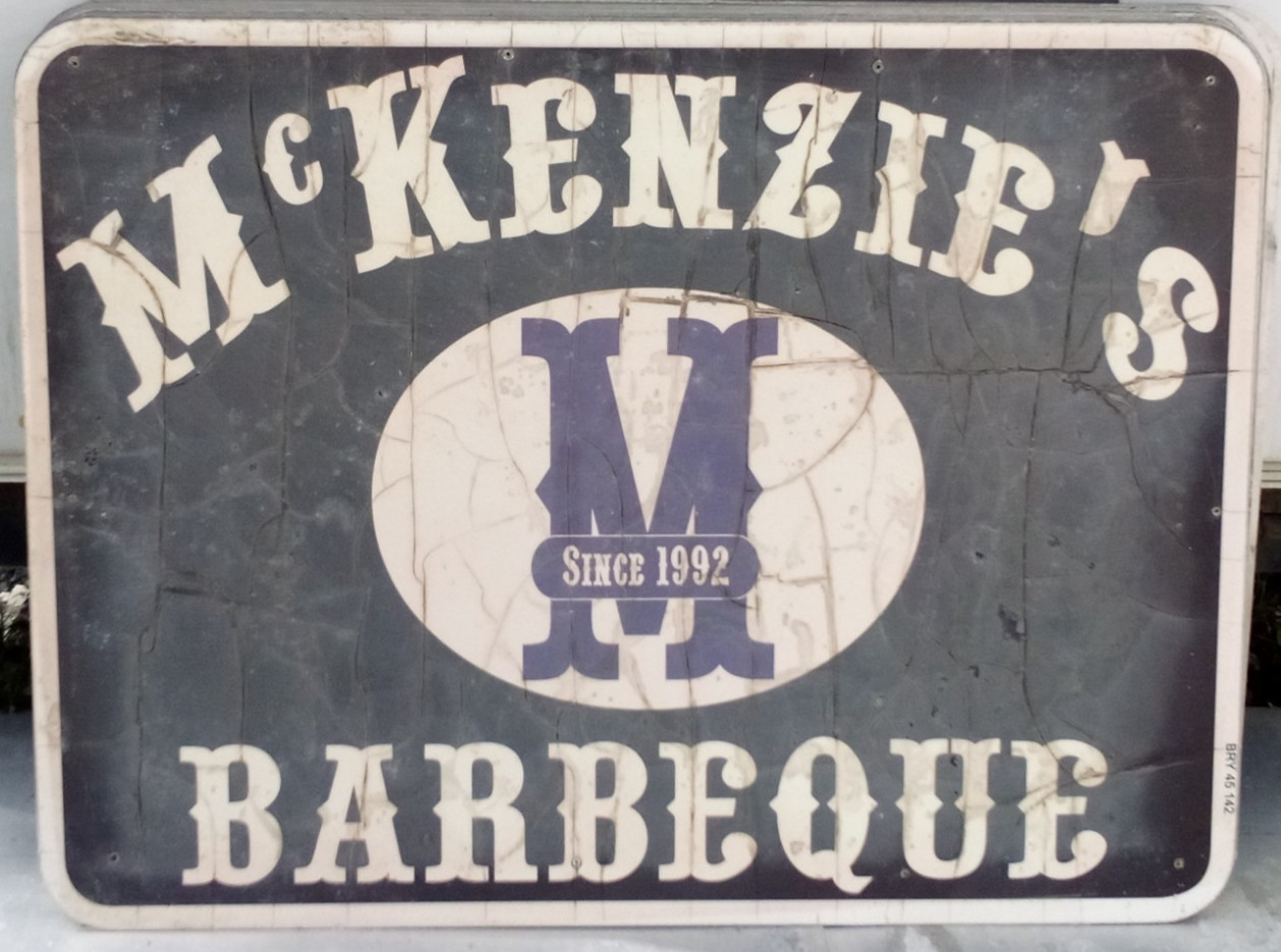 AUTHENTIC RETIRED ADVERTISING HWY EXIT SIGN MCKENZIE’S BARBEQUE BBQ 48X36 A36