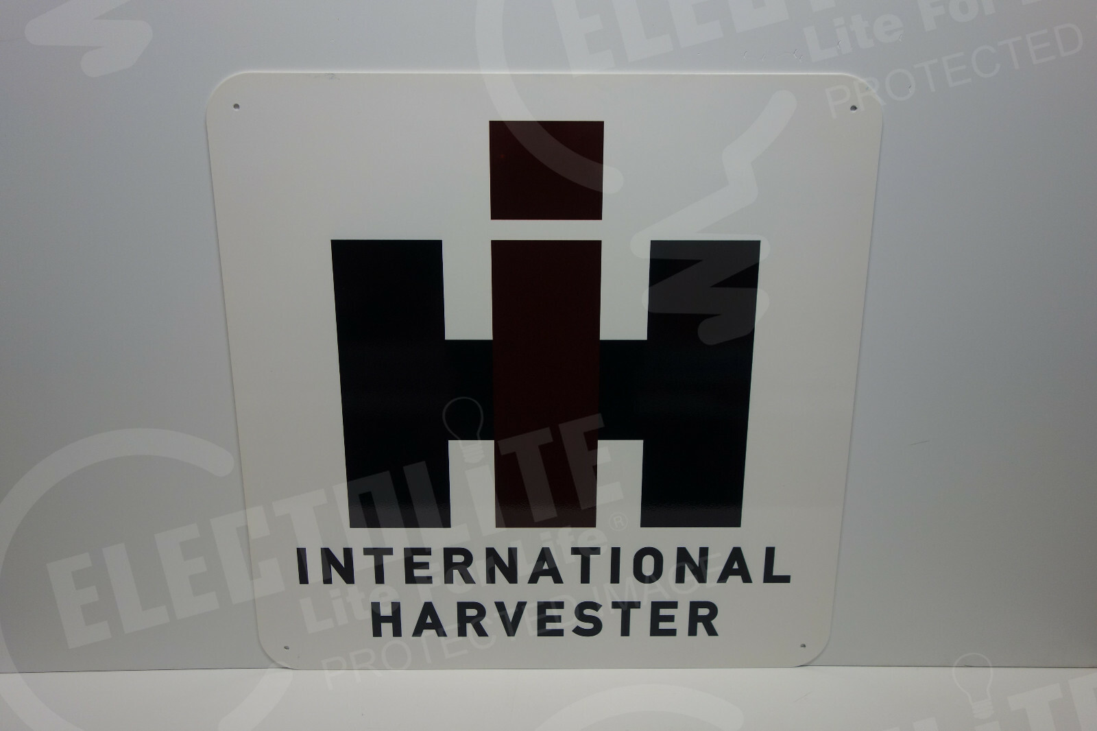 International Harvester DIE CUT DEALER ENAMEL COAT SIGN. 23″ BY 23″. AMAZING!