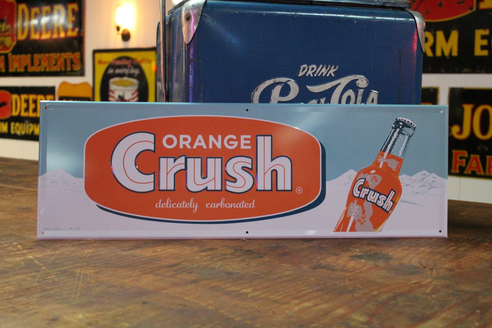 ORANGE CRUSH SODA POP EMBOSSED METAL SIGN WITH BOTTLE MOUNTAINS STORE COKE PEPSI