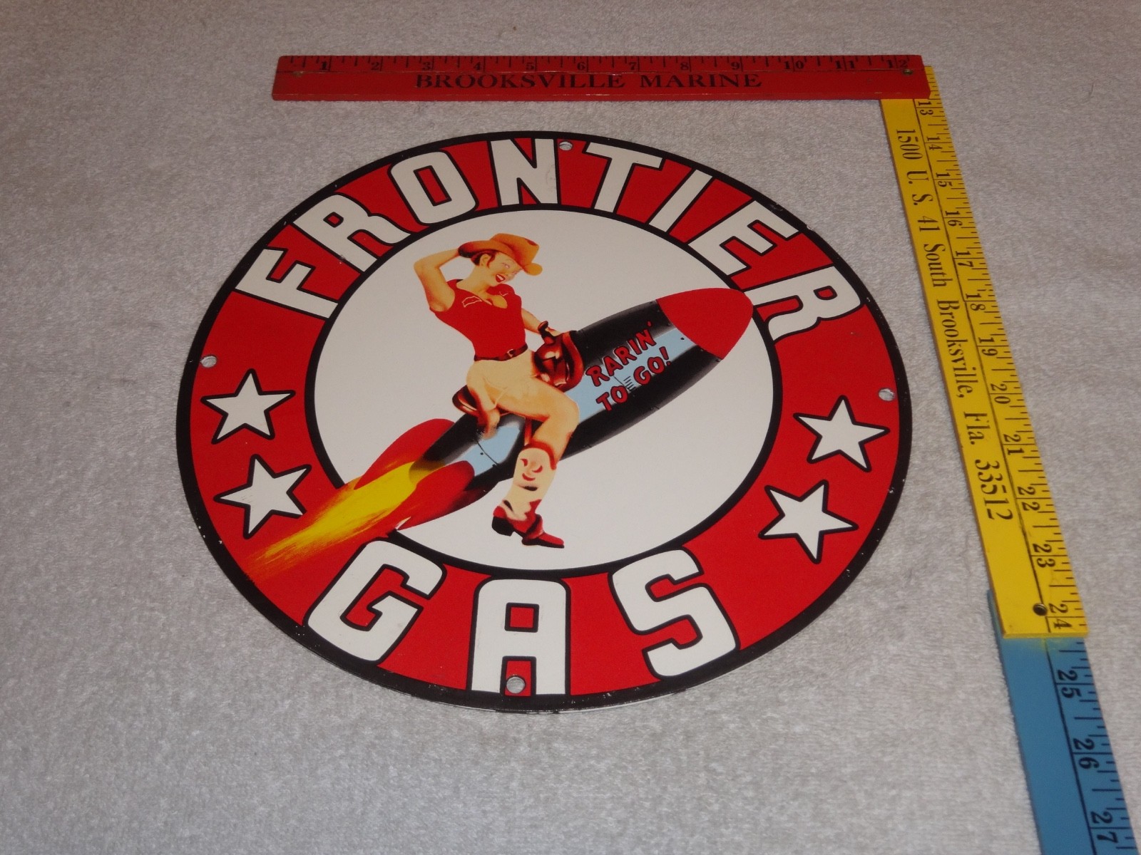 VINTAGE FRONTIER GASOLINE WOMAN ON ROCKET 11 3/4″ PORCELAIN METAL GAS & OIL SIGN