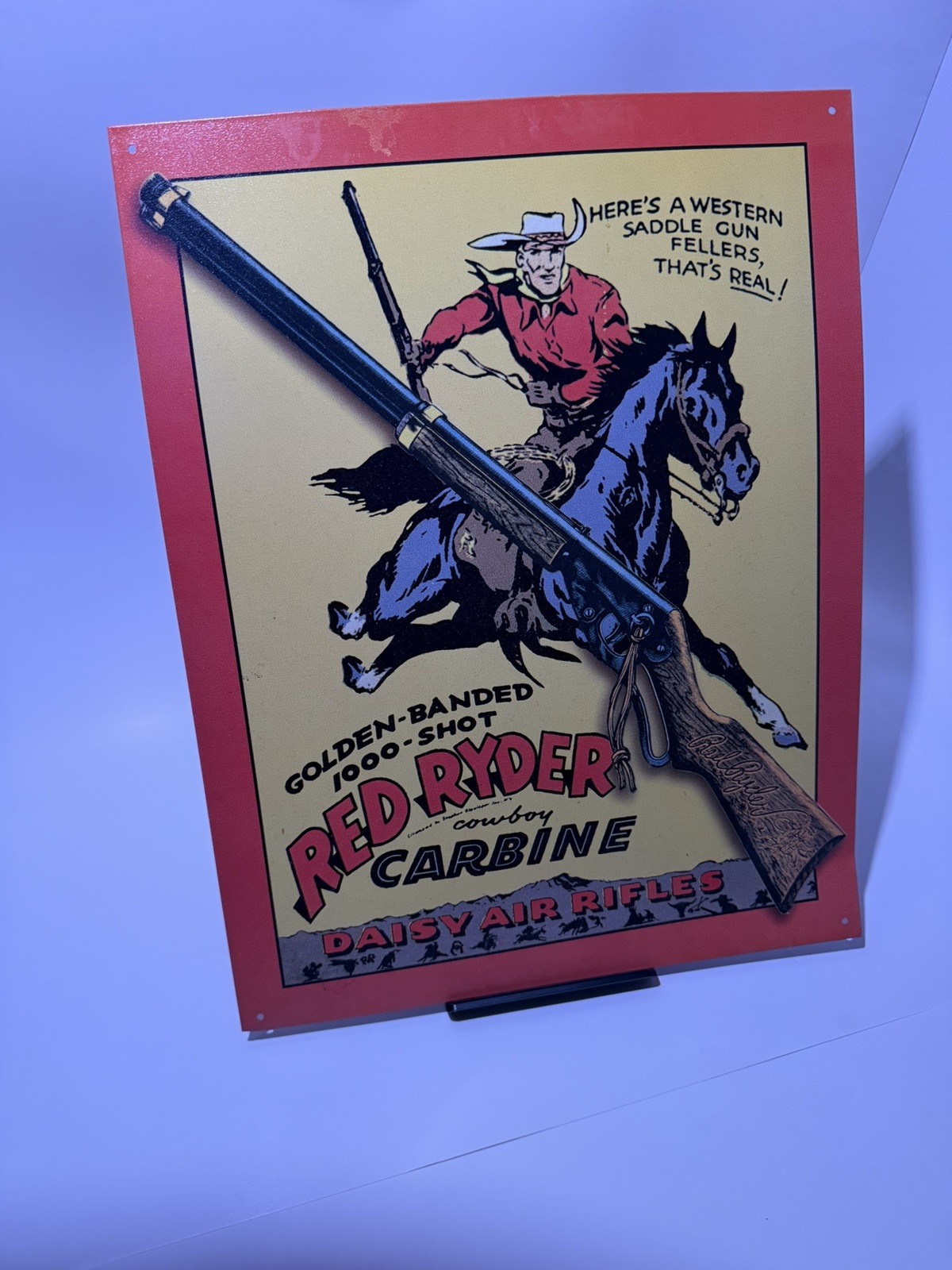 VINTAGE 12×16 in DAISY AIR RIFLE COWBOY RED RIDER ADV SIGN TIN METAL TACKER