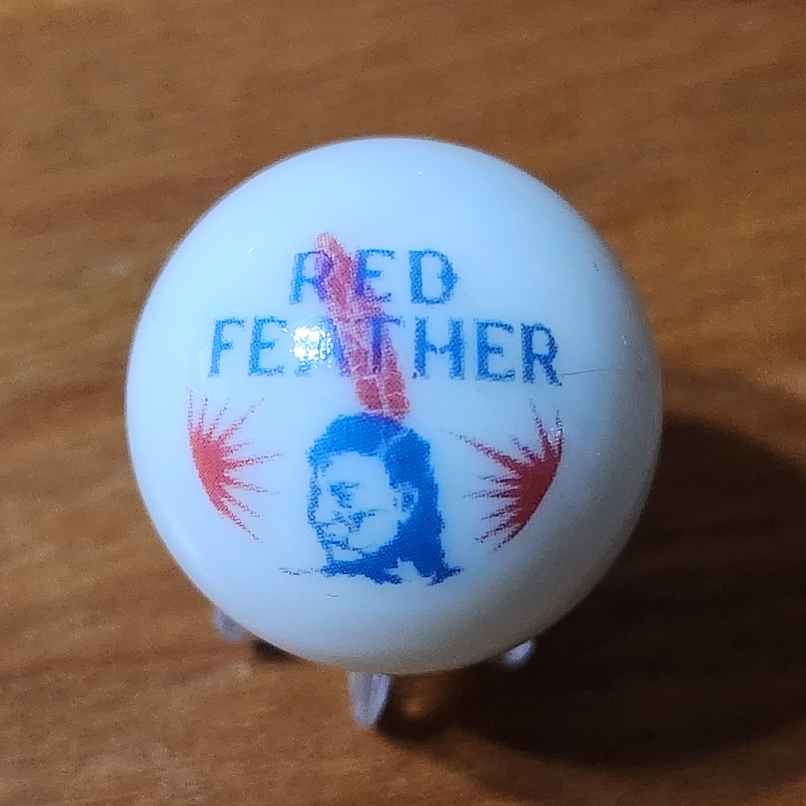 RED FEATHER GASOLINE ADVERTISING MARBLE 1″ SHOOTER & STAND MOTOR OIL COLLECTIBLE