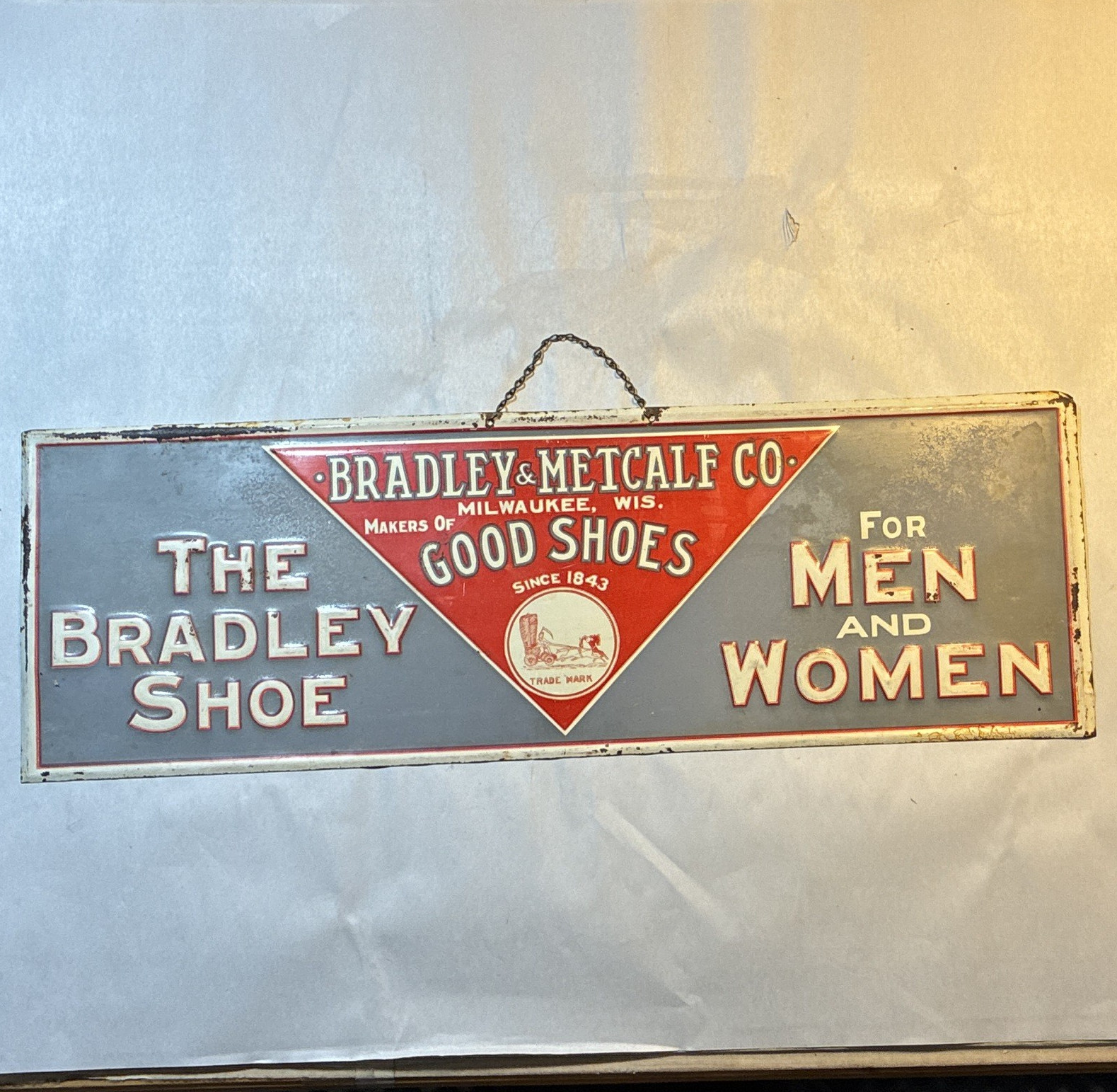 The Bradley Shoe for Men and Women “Since 1843” embossed metal sign with chain