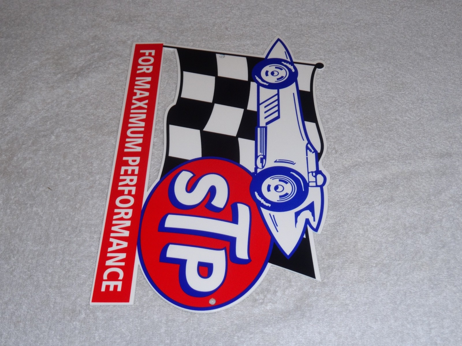 VINTAGE STP OIL ADDITIVE + RACE CAR & FLAG 12″ METAL DIE-CUT GASOLINE SIGN S T P
