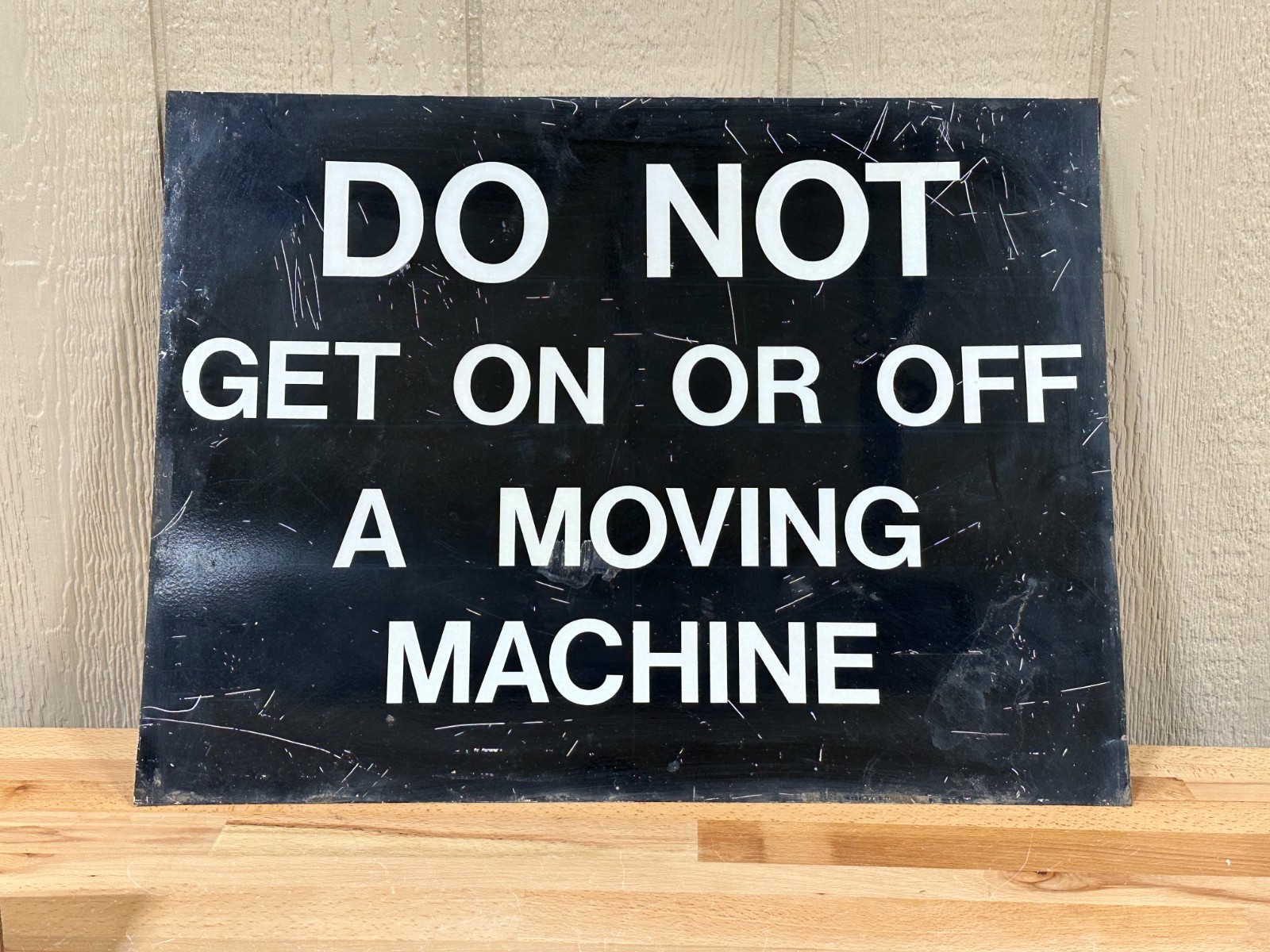 Vintage metal industrial sign Do not get on or off moving machine 18″ x 24″