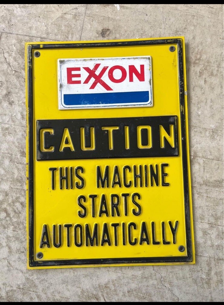 plastic and metal Exxon vintage Machine sign