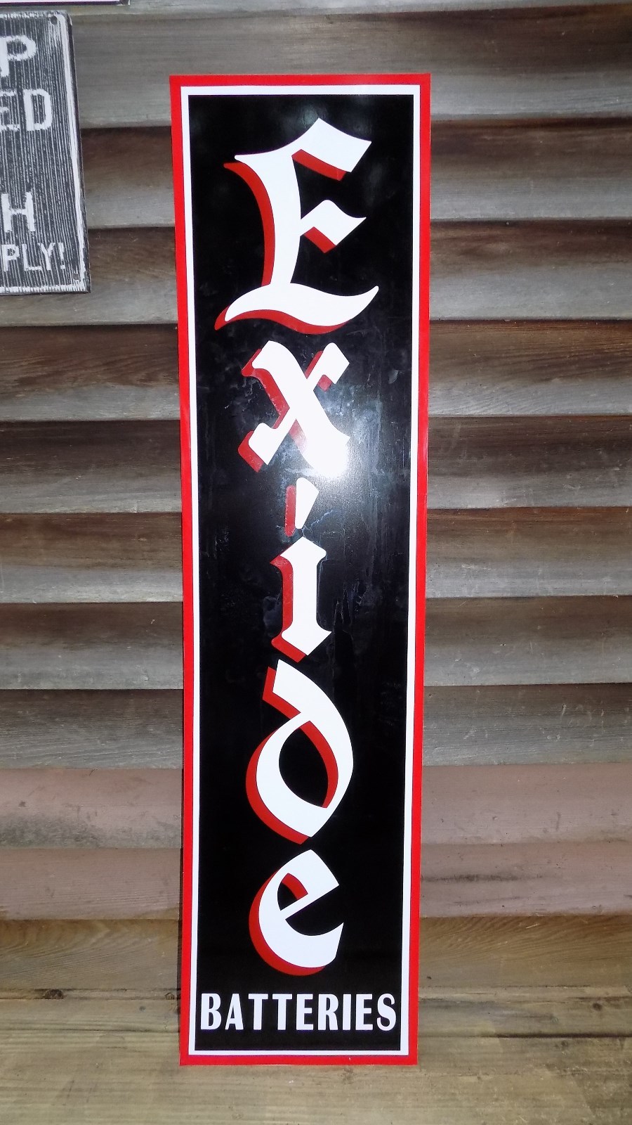 C.1930’S EXIDE BATTERIES 1’X46” 3 COLOR METAL DEALER/SERVICE SIGN-GARAGE ART