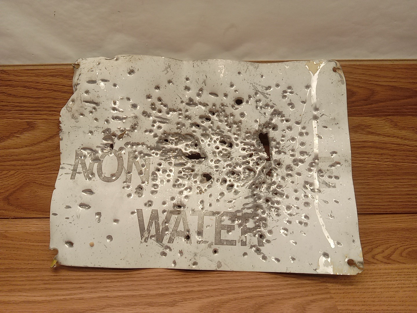 Old Rustic Sign Riddled With Bullet Holes Non Potable Water