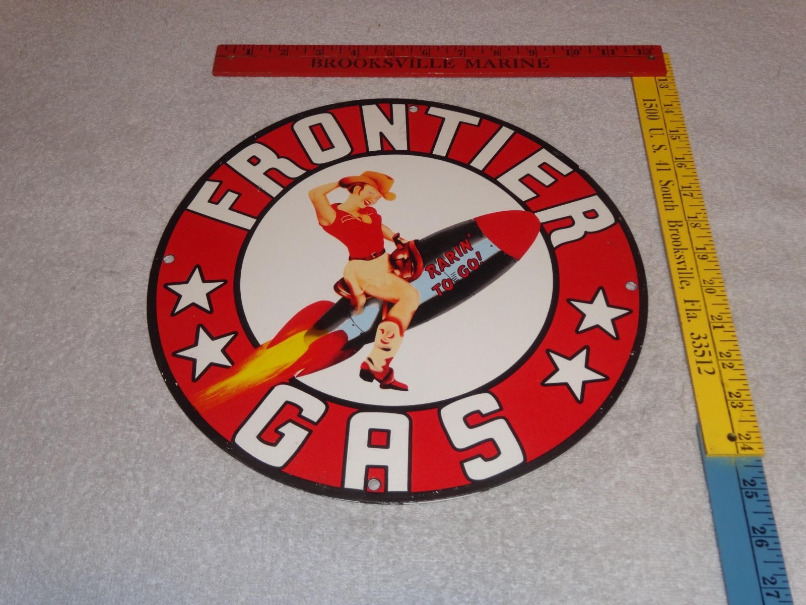 VINTAGE FRONTIER GASOLINE WOMAN ON ROCKET 11 3/4″ PORCELAIN METAL GAS & OIL SIGN