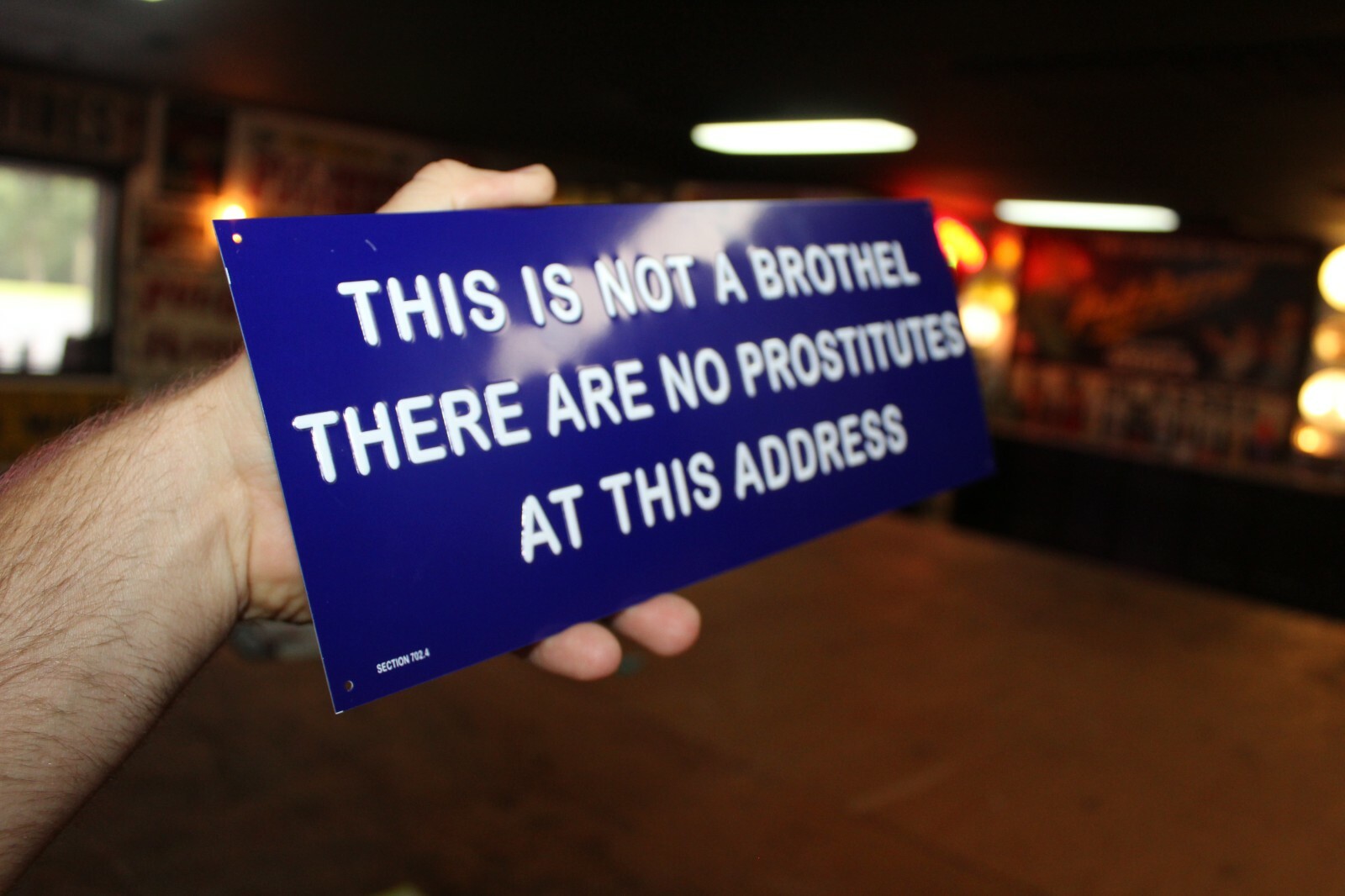 NOT A BROTHEL NO PROSTITUTES EMBOSSED METAL SIGN STRIP CLUB GAS OIL FUNNY HUMOR