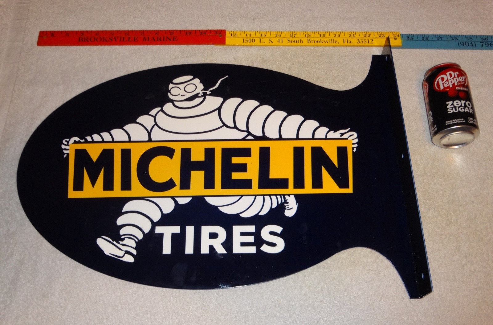 VINTAGE MICHELIN TIRES BIBENDUM MAN CIGAR 22.5″ METAL GASOLINE & OIL FLANGE SIGN