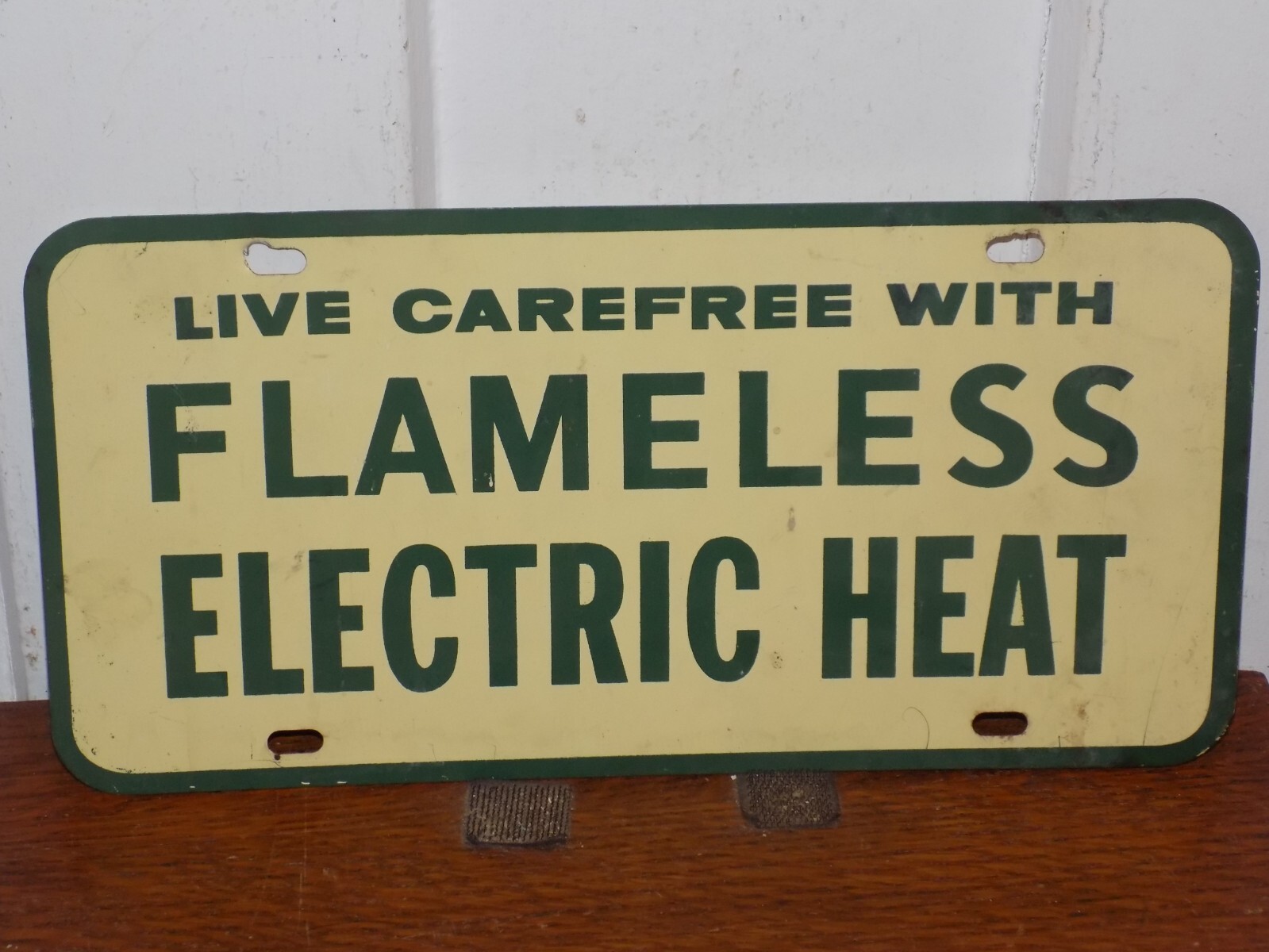 Vintage Live Carefree With Flameless Electric Heat Metal License Plate Sign