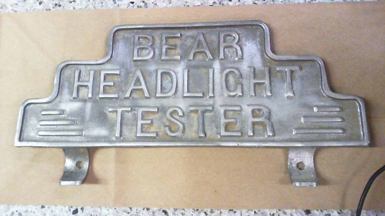 VINTAGE BEAR HEADLIGHT TESTER ADV. SIGN 11 x 5.5 in HEAVY CAST ALUMINUM
