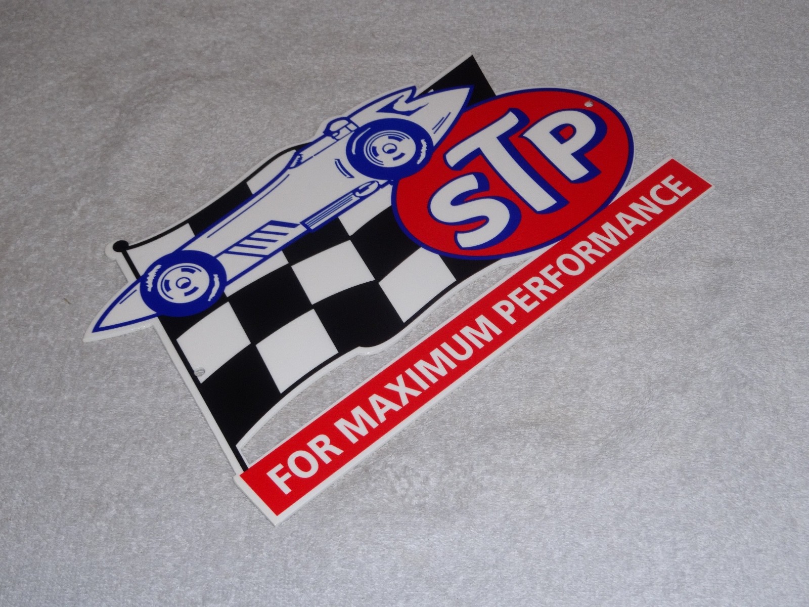 VINTAGE STP OIL ADDITIVE + RACE CAR & FLAG 12″ METAL DIE-CUT GASOLINE SIGN S T P
