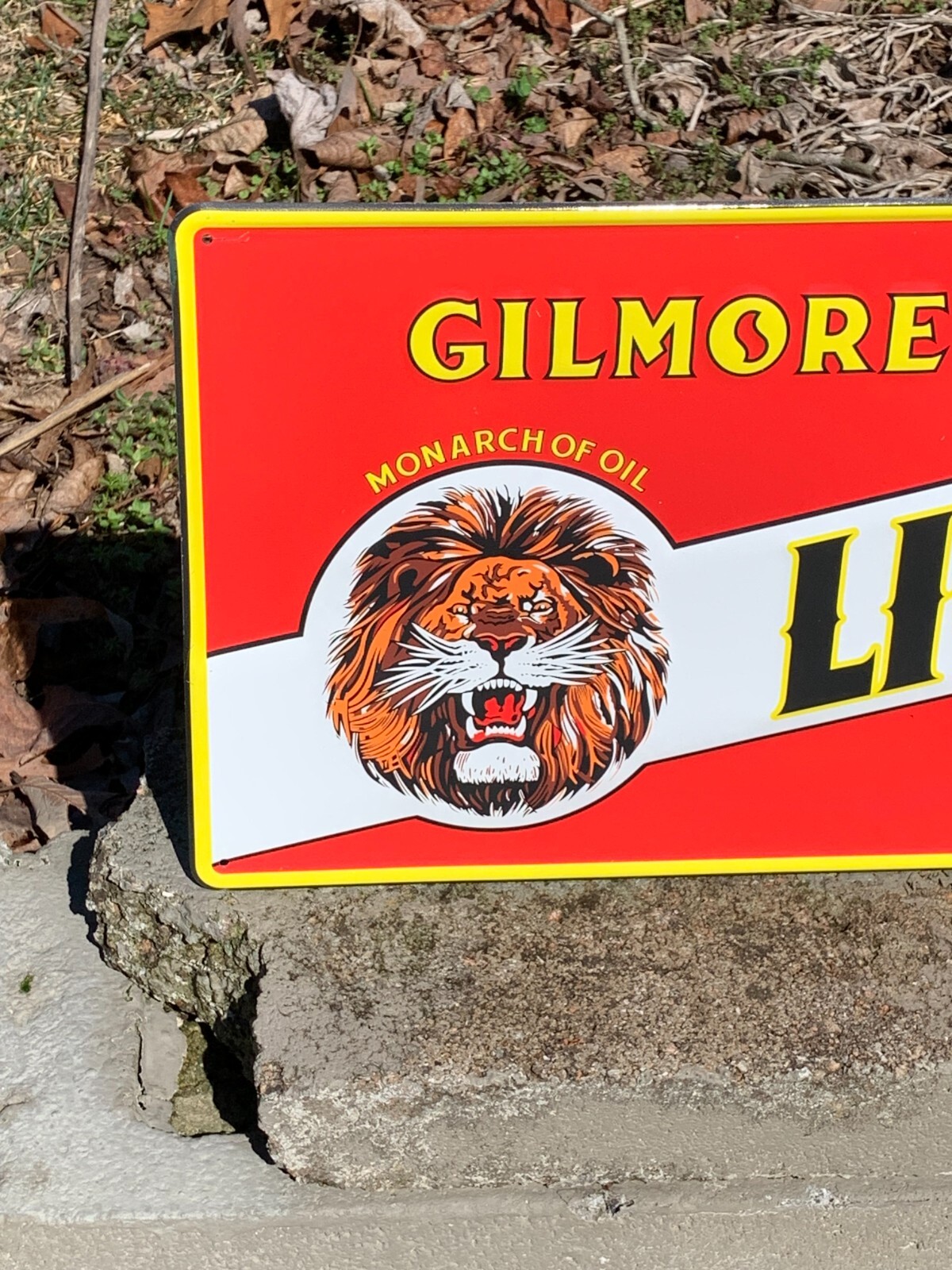 “LION HEAD MOTOR OIL” EMBOSSED METAL SIGN, (23.5″x 9.5″) EXCELLENT CONDITION